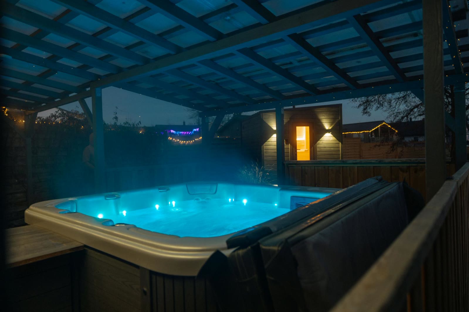 Private illuminated jacuzzi in the wellness garden