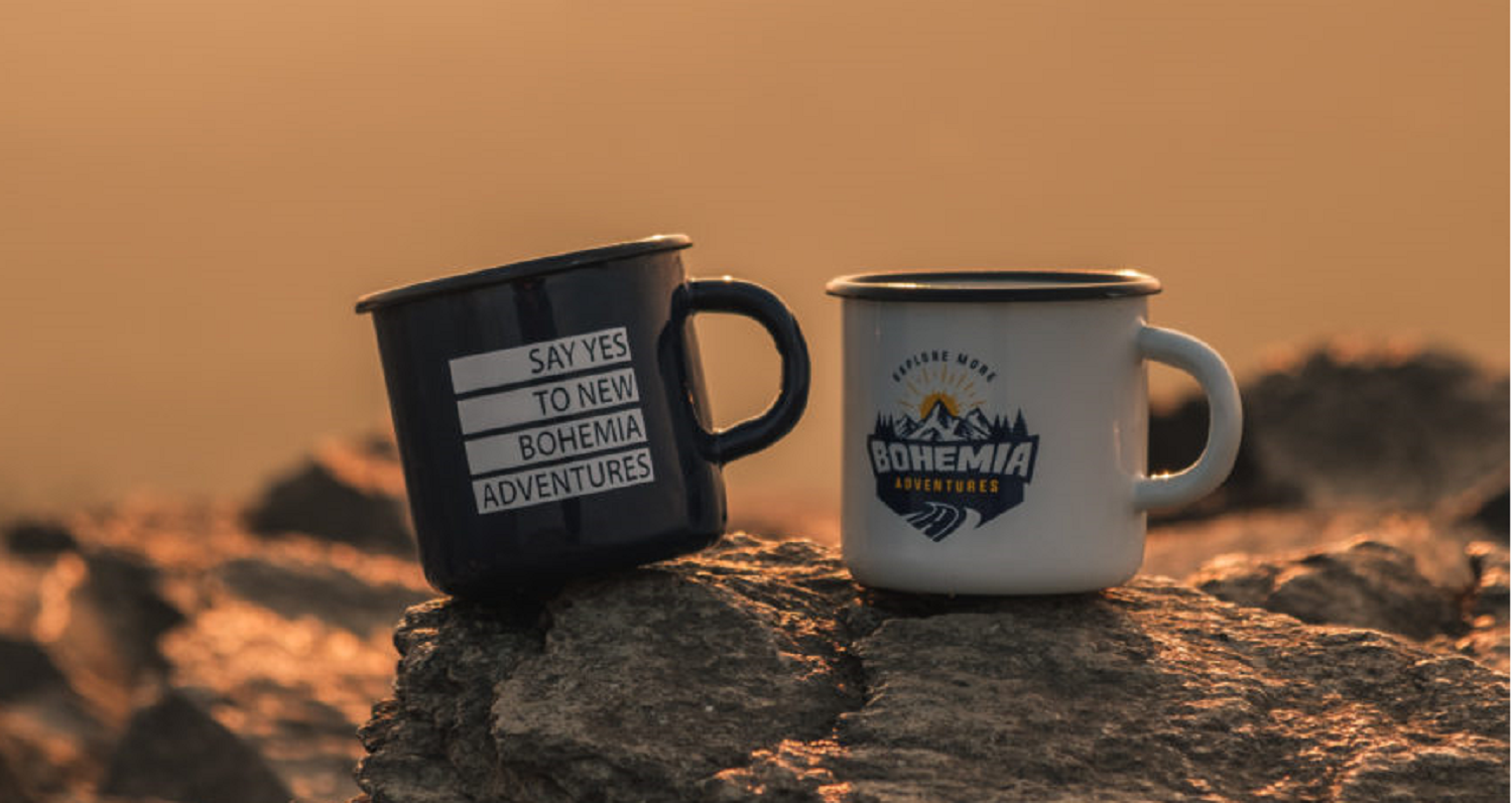 Two Bohemia Adventures mugs in warm evening light